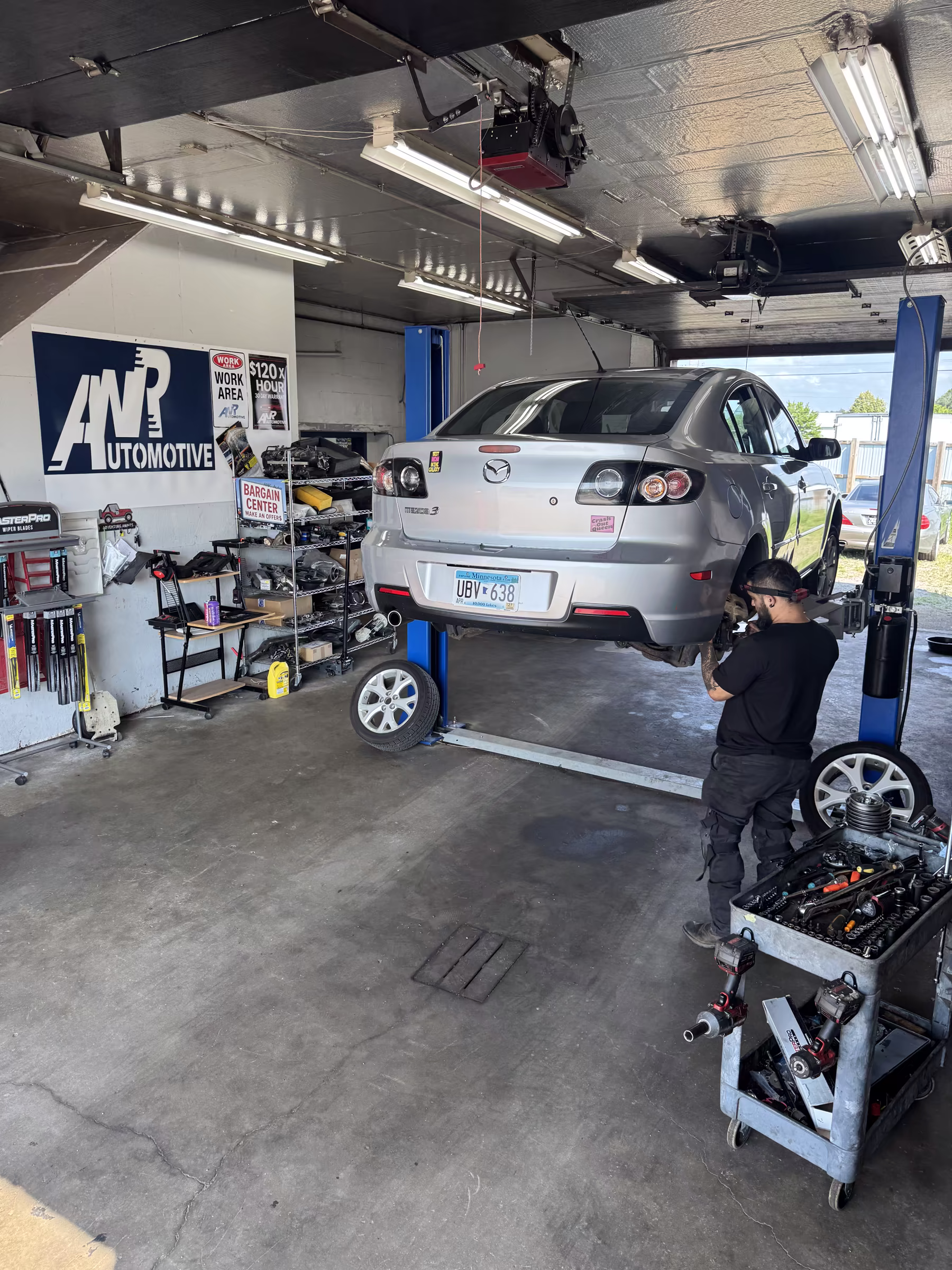 ANR Automotive technician working on a vehicle